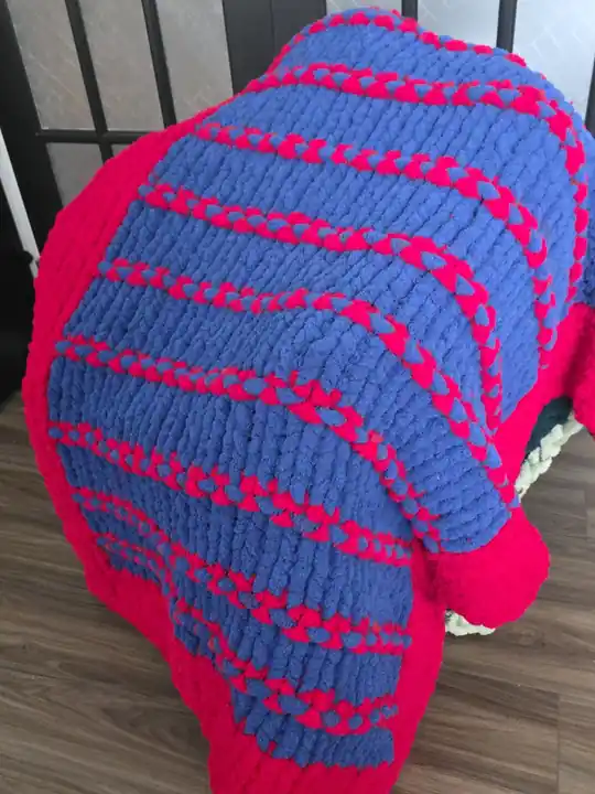 Customer-made chunky knit blanket in bright pink and blue stripes