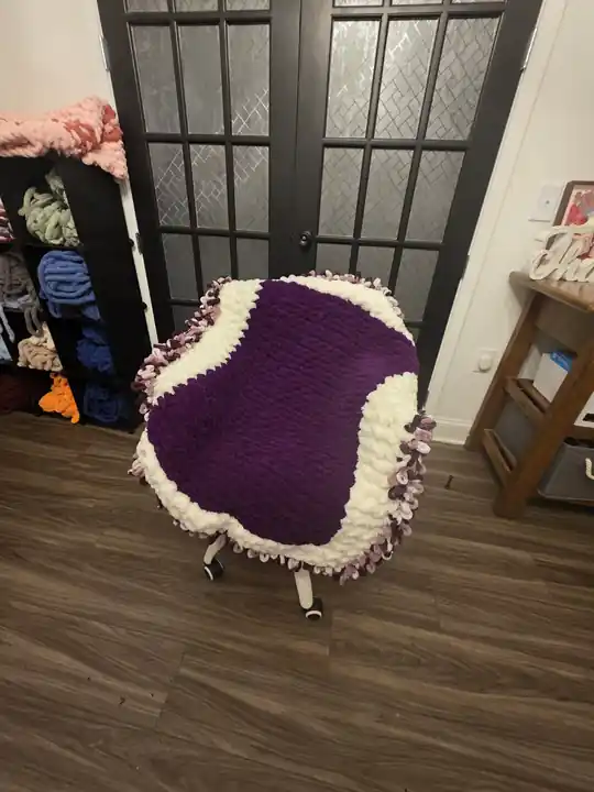Customer-made purple chunky knit blanket with a cream border